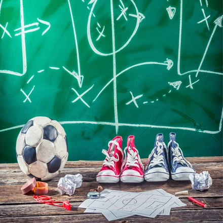 Image of play board with soccer ball and converse shoes