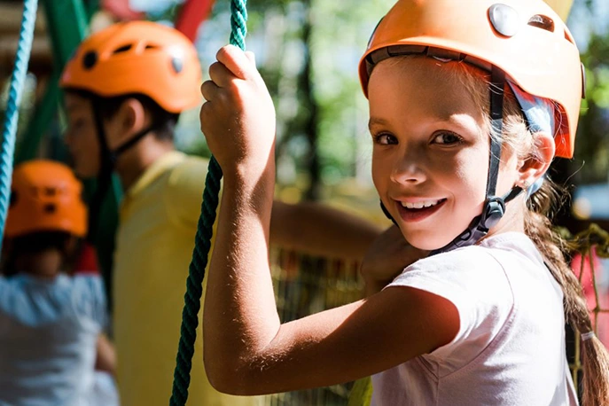 selective focus of happy kid in helmet